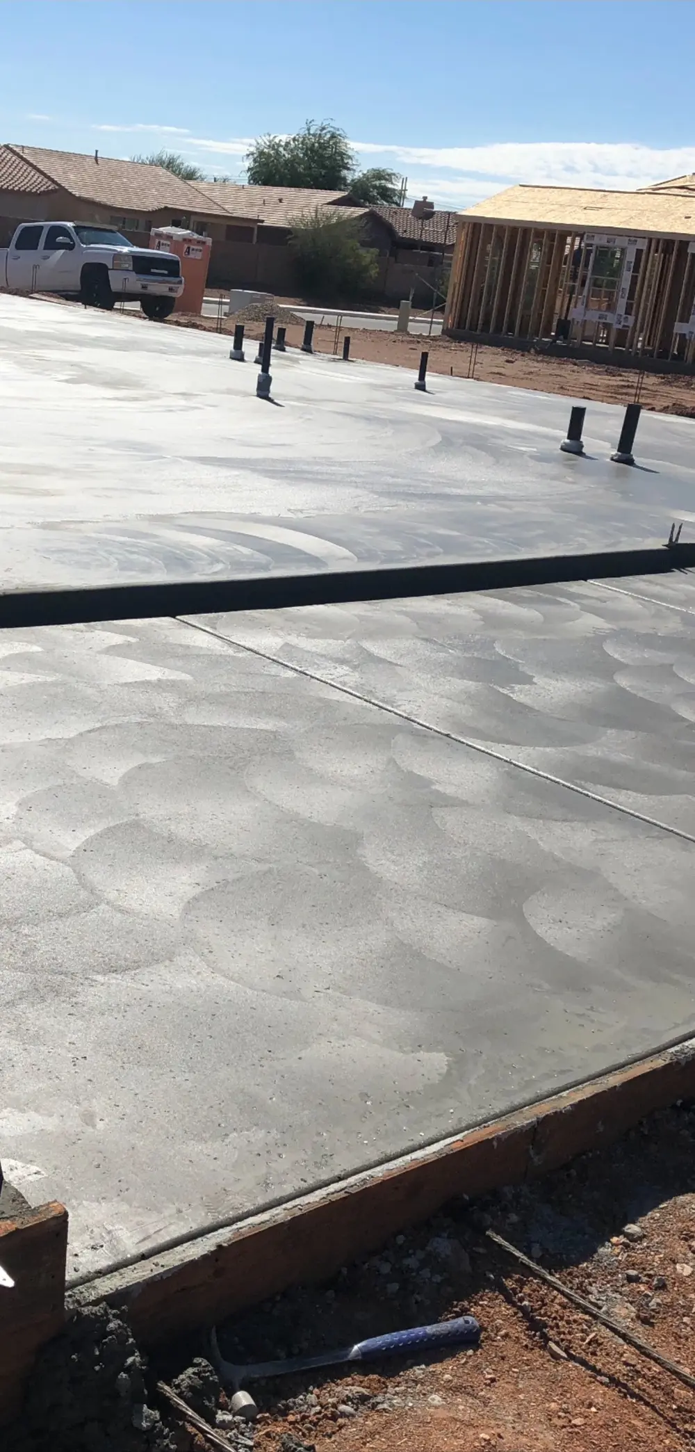 Two concrete slabs with swirl and smooth finishes poured side by side in Phoenix AZ